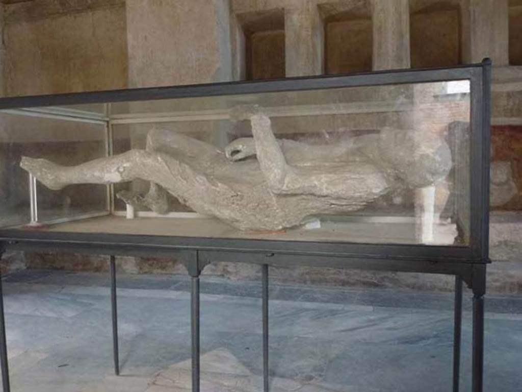Pompeii. May 2018. Plaster cast of victim numbered 15. Photo courtesy of Buzz Ferebee. 
According to Garcia y Garcia, she was known as victim no.14.
This victim was recovered from near the Porta Stabia on 11th October 1889.
She had fallen face down but was always displayed as if she was found lying on her back.
See Garcia y Garcia, L., 2006. Danni di guerra a Pompei. Rome: L’Erma di Bretschneider. (p. 193-4, Figg. 451-3).
