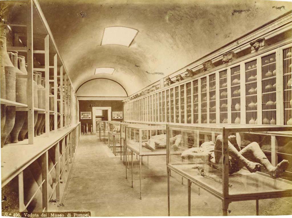 Victim number 9, photographed in display case, on the right. Interior of Pompeii Museum before 1889, (Room II). Photo: Edizioni Brogi.
Photo courtesy of Eugene Dwyer.
