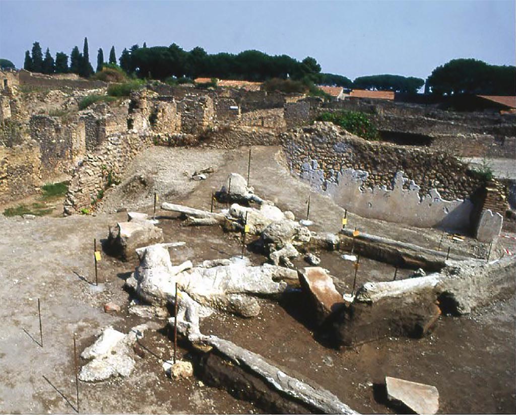 I.22.1 Pompeii. 1989. Plaster casts of victims 70 to 78.

Alla fine di agosto del 1989 fu scoperto, in un settore non precedentemente scavato dell'angolo nord-ovest dell'Insula 22 della Regio I, un gruppo di dieci vittime, nello strato di cenere ad una altezza di circa 2,50 metri dal piano di calpestio antico, di cui si riuscì a farne il calco di nove lasciati in situ con adeguata copertura; anche in questo caso non è da escludersi che il gruppo era legato da vincoli di parentela per la presenza di due bambini e forse di una donna incinta abbracciata ad un uomo (NAPPO 1992, pp. 16-18).

At the end of August 1989 a group of ten victims was discovered in a previously unexcavated sector of the north-west corner of Insula 22 of Regio I, in the ash layer at a height of approximately 2.50 metres from the ancient floor level, of which it was possible to make nine casts, which were left in situ with adequate covering; also in this case it cannot be excluded that the group was linked by family ties due to the presence of two children and perhaps of a pregnant woman hugging a man (NAPPO 1992, pp. 16-18) 

Vedi/See De Carolis E., and Patricelli D., 2018. Impronte Pompeiane. Roma: L'Erma di Bretschneider, p. 105, (fig. 85).
