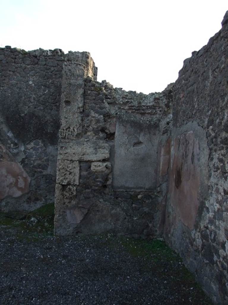 VIII.5.4 Pompeii. December 2007. South-west corner of shop. According to Eschebach this is the area of an “open rear room with niche”. According to Boyce, Fiorelli reported that this shop had a “nicchia dei Penati”, which Boyce said was in ruins (c.1937?).
See Eschebach, L., 1993. Gebäudeverzeichnis und Stadtplan der antiken Stadt Pompeji. Köln: Böhlau. (p.380)
See Boyce G. K., 1937. Corpus of the Lararia of Pompeii. Rome: MAAR 14. (p.77, no.367) 
