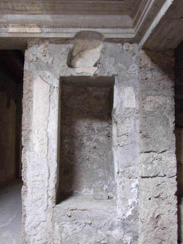 IX.13.1-3 Pompeii. March 2009. Room 2, north-east corner of atrium. 
Recess with 2 niches.
