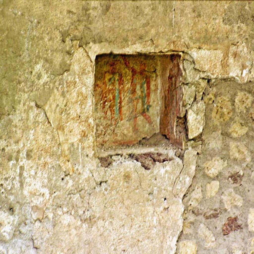 Oplontis, Villa of Lucius Crassius Tertius. March 2005. Rectangular lararium niche, with painting of two figures? 
Photo courtesy of Massimo Gravili.
