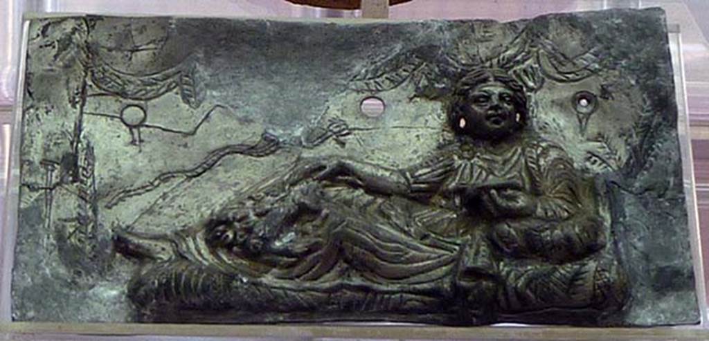 Boscoreale, Villa rustica in via Casone Grotta, proprietà Risi di Prisco. Lararium. Restored silver plaque with relief of a female figure relaxing.
Now in Boscoreale Antiquarium. Photo courtesy of Michael Binns.
