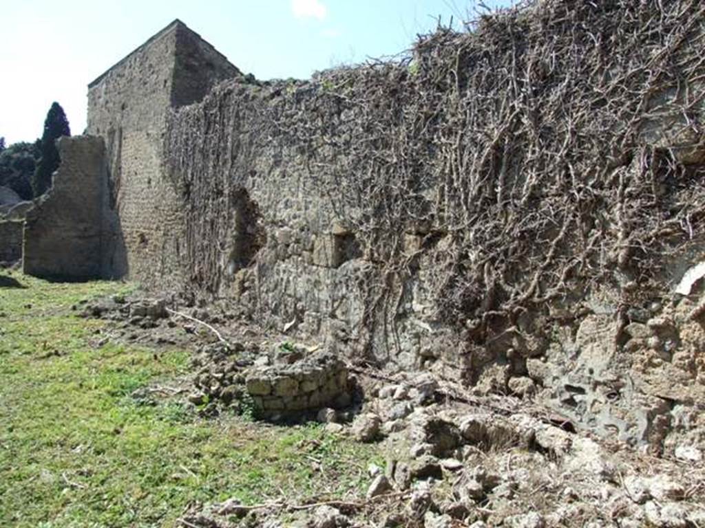 I.3.27 Pompeii. March 2009. North wall of pistrinum. According to Fiorelli, when excavated the remains of a painted lararium were found somewhere in this area. Fiorelli said only the two serpents approaching the prepared altar remained visible.
See Pappalardo, U., 2001. La Descrizione di Pompei per Giuseppe Fiorelli (1875). Napoli: Massa Editore. (p. 40)
Boyce said, on one wall was a fragmentary lararium painting, of which a single Lar, and the serpents confronted at an altar with offerings, were visible at the time of excavation.
See Boyce G. K., 1937. Corpus of the Lararia of Pompeii. Rome: MAAR 14. (p. 24) 
