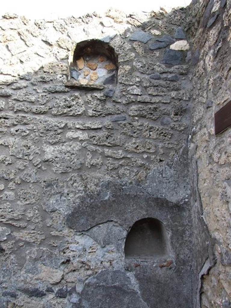 I.12.9 Pompeii. December 2007. Niches on east wall in south-east corner of atrium.