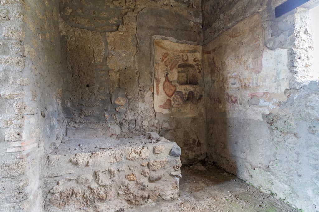 I.13.2 Pompeii. March 2023. Looking north in kitchen with painted lararium in north-east corner. Photo courtesy of Johannes Eber.