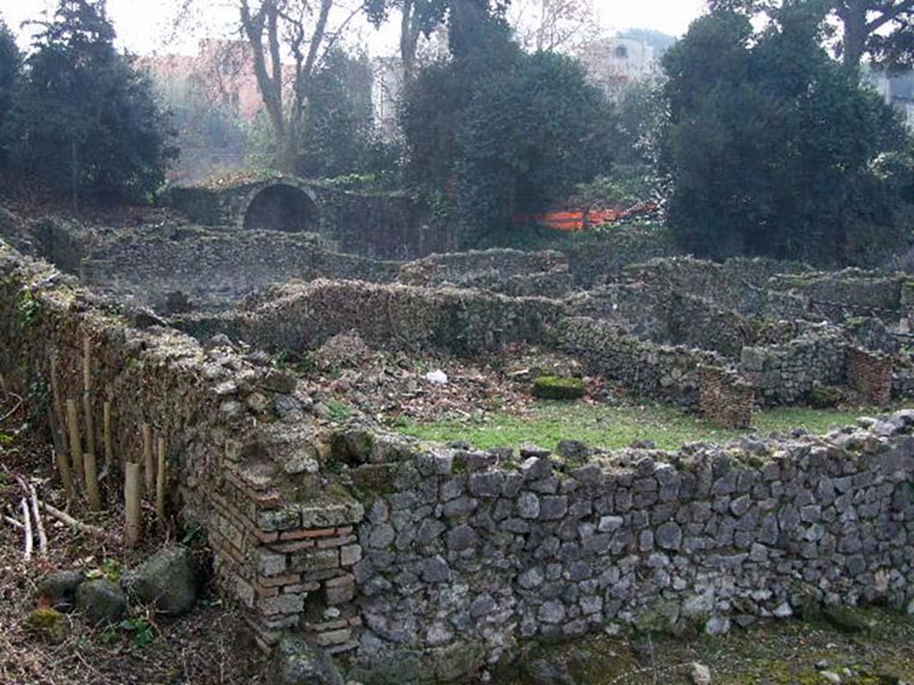 I.1.8 Pompeii. December 2006. Rear of hospitium, looking south across I.1.8 towards Stabian Gate, from Vicolo del Conciapelle.