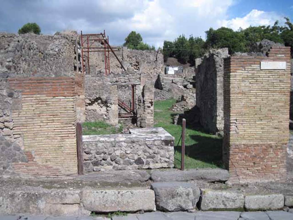1.2.1 Pompeii. September 2010. Entrance looking east, from Via Stabiana. The side/rear doorway can be seen at I.2.32, on the right. Photo courtesy of Drew Baker.

Warscher described this as 
I.2.1 una ampia caupona a due porta, poich risponde anche nel vico a mezzogiorno col vano segnato dal No.32.
See Warscher T., 1935. Codex Topographicus Pompeianus: Regio I.2.(after photo no.1). Rome:DAIR, whose  copyright it remains.
