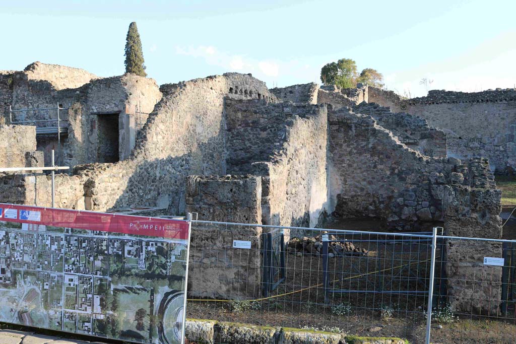 I.2.7 Pompeii. December 2018. 
Looking east to entrance doorway, on right, with I.2.8, on left, behind screening. Photo courtesy of Aude Durand.
