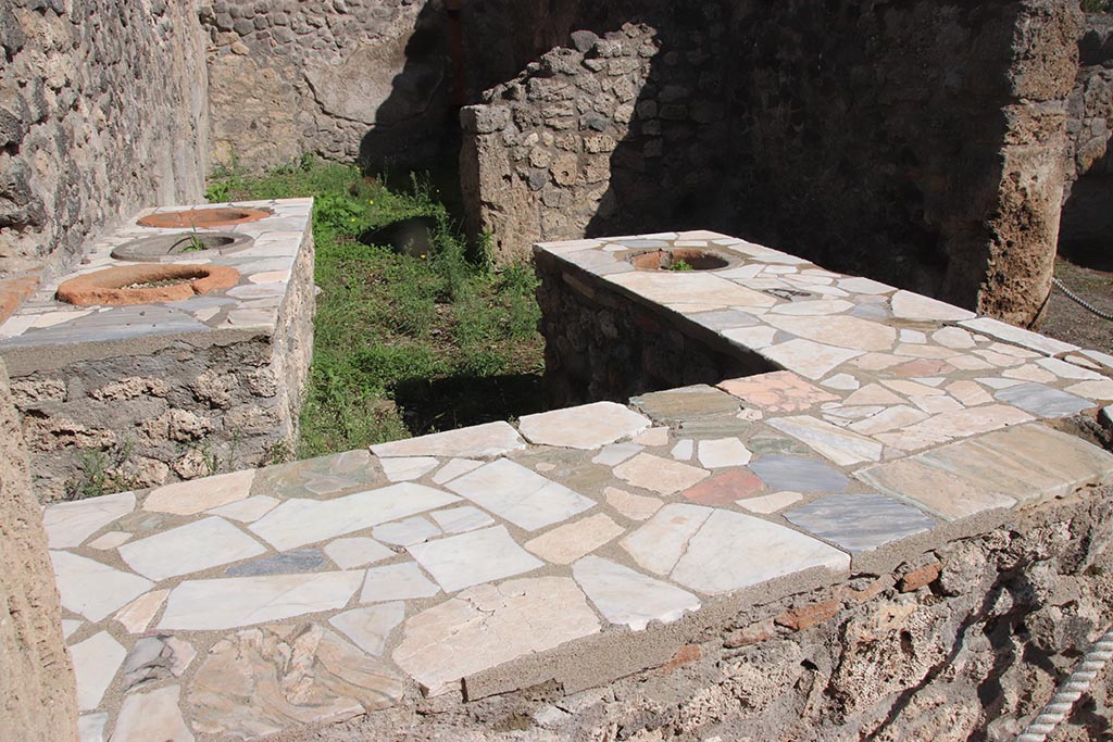 I.2.8 Pompeii. October 2024. Looking east across bar towards rear room. Photo courtesy of Klaus Heese.