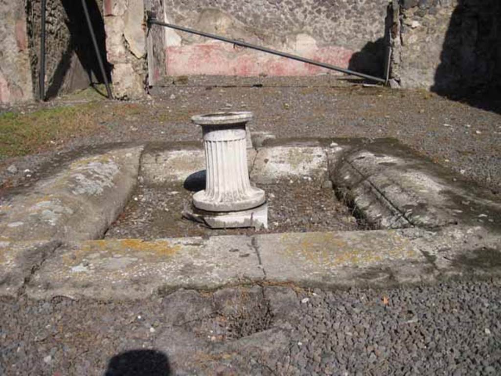 I.2.10 Pompeii. September 2010. Looking east across impluvium in atrium, towards tablinum. Photo courtesy of Drew Baker.
