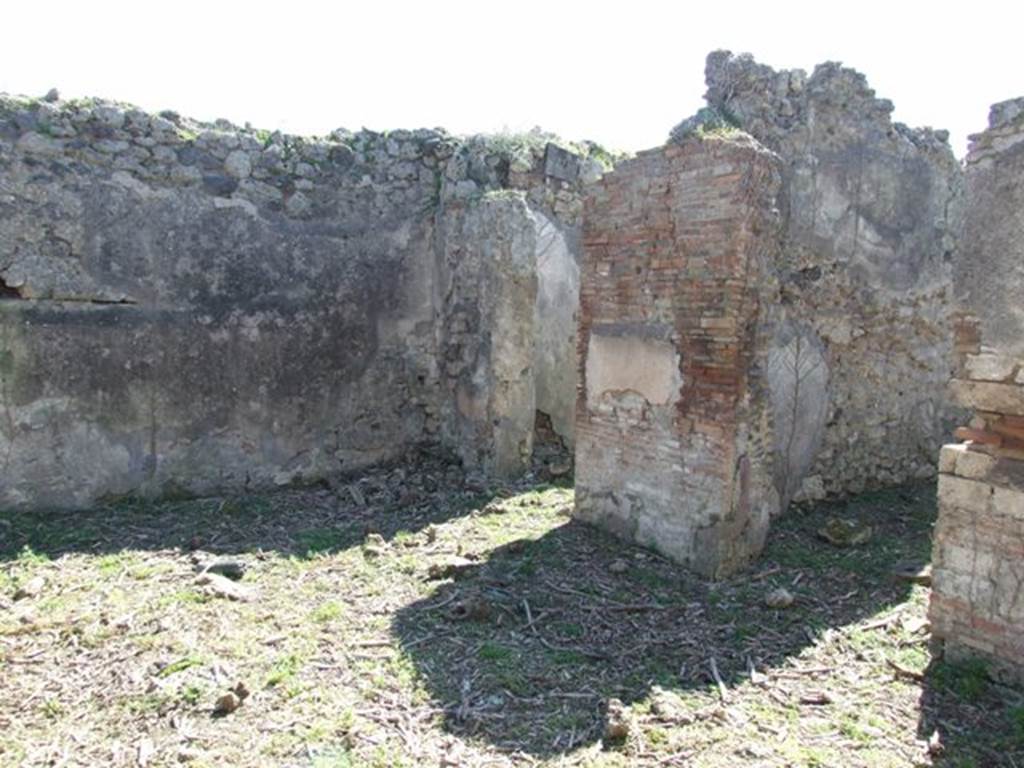 I.2.15 Pompeii. March 2009. Doorways to two rooms on west side of atrium.
According to Warscher, quoting Mau in Bull.Inst, 1873, p.240, she wrote 
Adesso le pareti della casa in questione sono nude. Nellanno 1873 Mau ha scritto 
Un piccolo quadro molto distrutto si trova in una stanza a destra dellatrio duna casa sul lato del nord della stessa isola, la cui porta  la quarta contando dallest.
Si distinguono due persone, delle quali quella seduta a sinistra  vestita di chitone giallo e clamide rossa. Mi pare essere un uomo. Gli sta dirimpetto un giovane che per il cappello e un bastone, che potrebbe essere un caduceo, forse deve ritenersi per Mercurio. Egli  vestito dun chitone giallo, corto e cinto e duna clamide che riposandogli sul braccio sinistra avvolge la parte media del corpo, lasciando libere le gambe.  Stende la mano destra verso la persona assisa.
See Sogliano, A., 1879. Le pitture murali campane scoverte negli anni 1867-79. Napoli: Giannini. (p.37, no.152, described as Hermes e figura indeterminata).
See Warscher T., 1935. Codex Topographicus Pompeianus: Regio I.2. Rome: DAIR.
(translation: "Now the walls of the house in question are nude. In the year 1873 Mau wrote   "A small very destroyed painting was located in a room to the right of the entrance hall of a house on the north side of the same insula, whose doorway was the fourth counting from the east. One can distinguish two people, the one sitting to the left was dressed in a yellow tunic and red cloak. It seemed to me to be a man.  He was facing a young man that by his hat and a cane, that may have been a caduceus, perhaps should be considered to be Mercury.  He was dressed in a short yellow tunic and girdle, and a cloak resting on his left arm that wrapped around the middle part of his body, leaving free the legs.  He was extending his right hand towards the seated person.")
