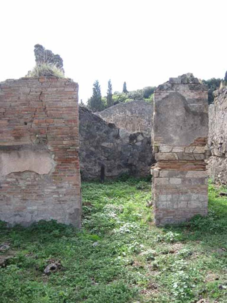 I.2.15 Pompeii. September 2010. Looking west to doorway to room on west side of atrium, on south side of corridor. Photo courtesy of Drew Baker.
