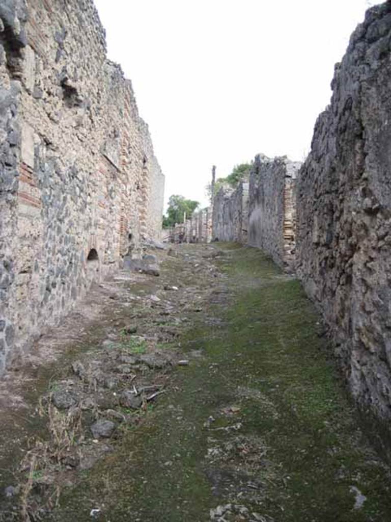 I.2.15 Pompeii. September 2010. Looking east along unnamed vicolo, from entrance doorway. Photo courtesy of Drew Baker.
