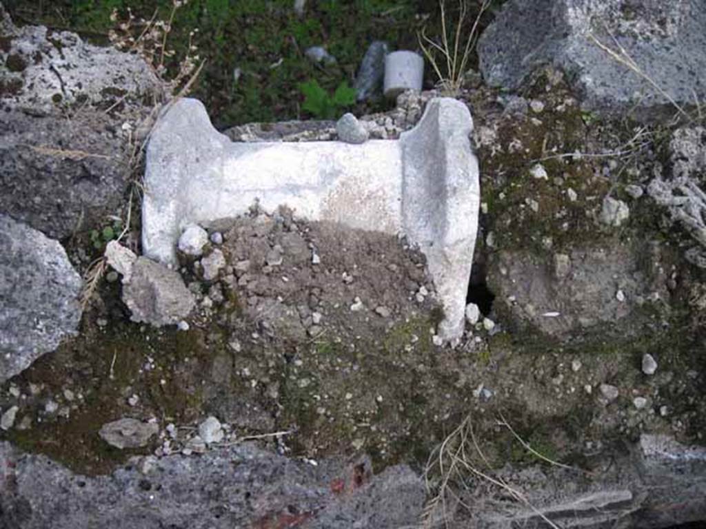 I.2.24 Pompeii. September 2010. Marble artefact in south wall. Photo courtesy of Drew Baker.
