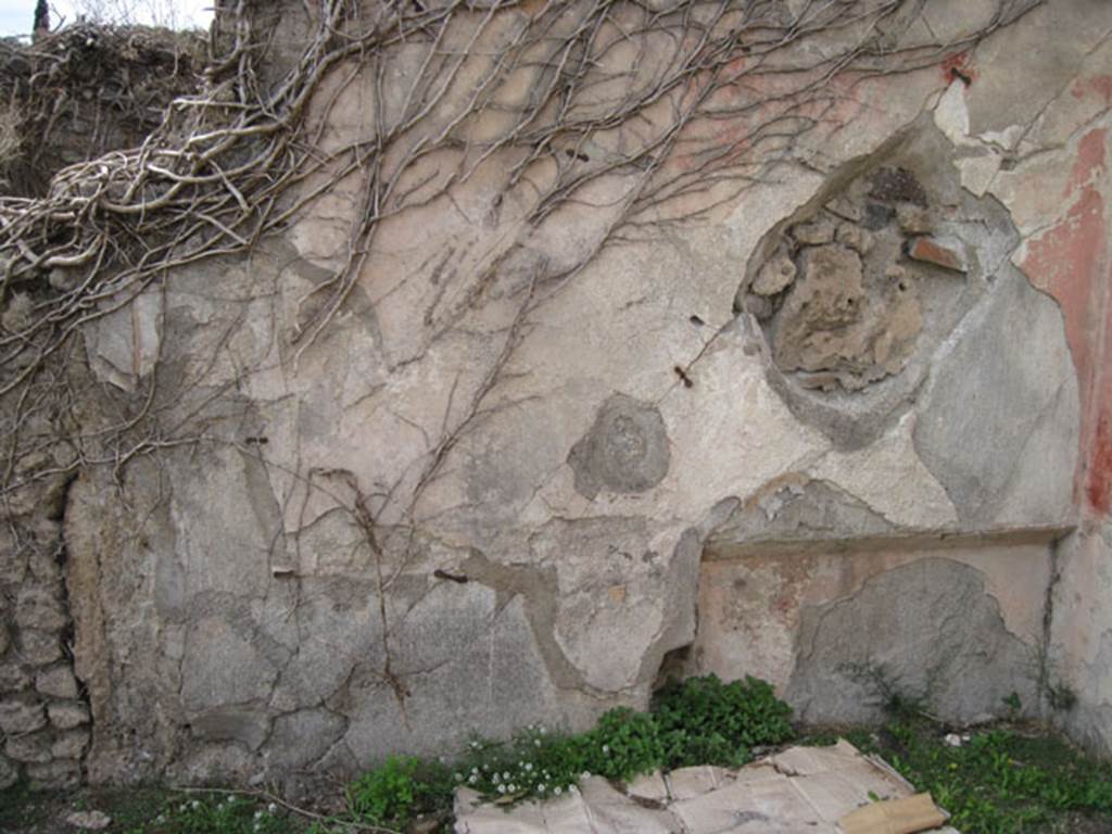 I.3.3 Pompeii. September 2010. Upper peristyle area, west wall with recess in room in north-west corner. Photo courtesy of Drew Baker.
