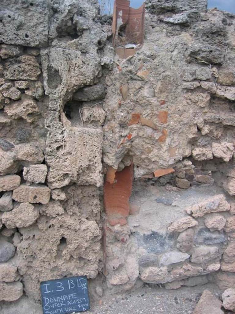 I.3.15 Pompeii. July 2008. Downpipe in north wall of rear room. Photo courtesy of Barry Hobson.