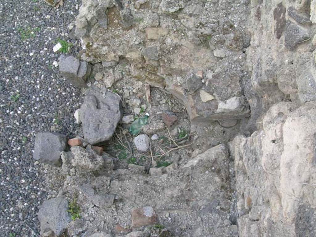 I.3.15 Pompeii. June 2005. Looking down on area in hearth for heating boiler, near west wall. Photo courtesy of Nicolas Monteix.
