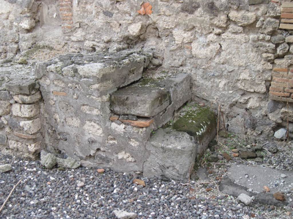 I.3.15 Pompeii. September 2010. West wall with detail of steps. Photo courtesy of Drew Baker.