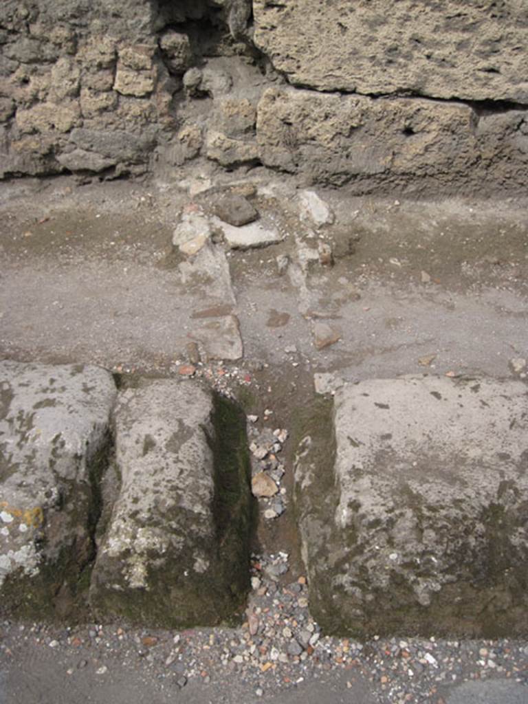 I.3.15 Pompeii. September 2010. Detail of drainage course opposite property in Vicolo del Menandro. Photo courtesy of Drew Baker.