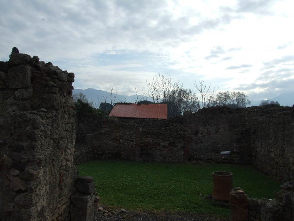 I.3.23 Pompeii. December 2006. Looking south across peristyle with west wall on right side of photo, the original position of the site of painting “Riot in the Amphitheatre”.
