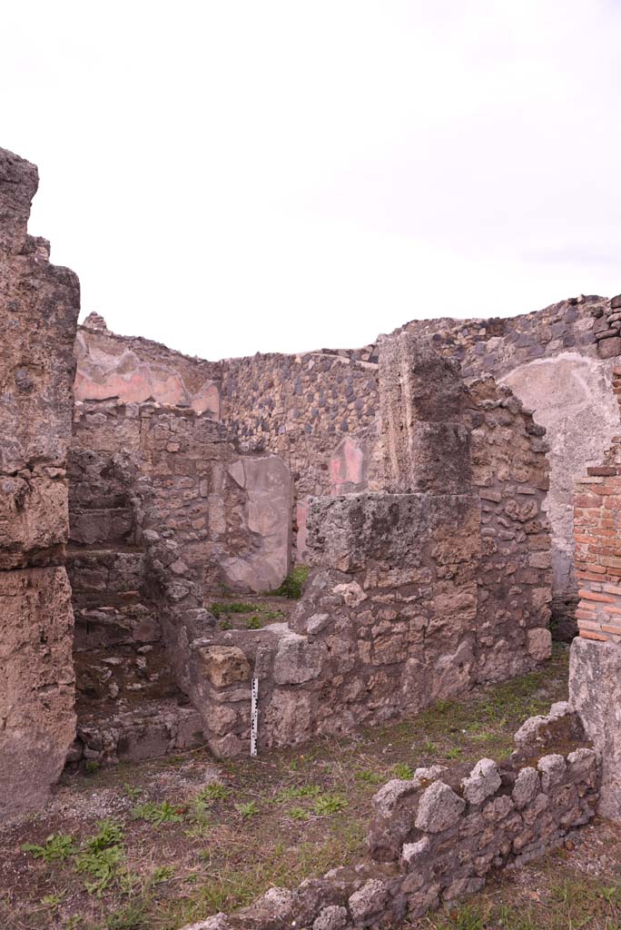 I.4.9 Pompeii. October 2019. 
Corridor i, looking north-east from tablinum, towards steps to upper floor in corridor, and wall of room l (L).
Foto Tobias Busen, ERC Grant 681269 DCOR.
