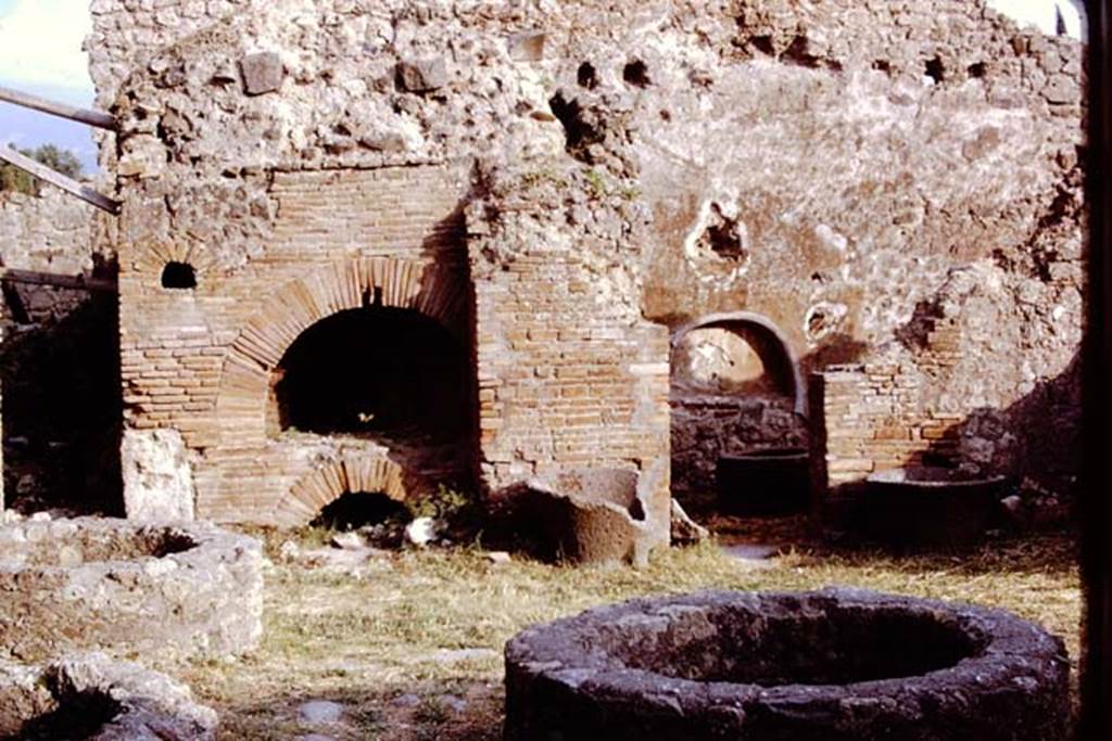 I.4.12 Pompeii. 1972. Looking south to oven in south-east corner, and doorway to room on its west side. Photo by Stanley A. Jashemski. 
Source: The Wilhelmina and Stanley A. Jashemski archive in the University of Maryland Library, Special Collections (See collection page) and made available under the Creative Commons Attribution-Non Commercial License v.4. See Licence and use details.
J72f0150

