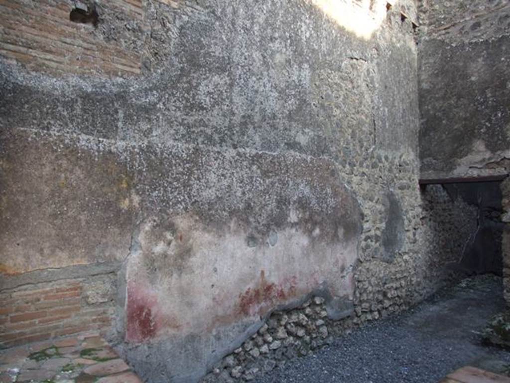 I.4.27 Pompeii. December 2007. East wall of front bar or sales-room, with doorway to rear room, on right.