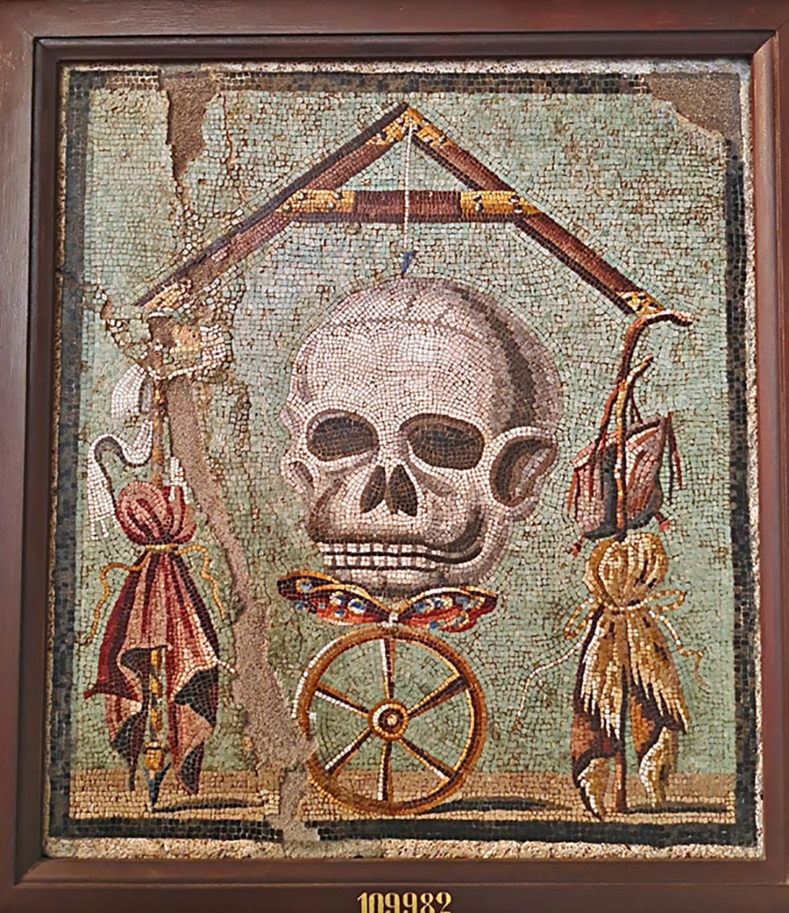 1.5.2 Pompeii. Triclinium in peristyle garden. Mosaic of a skull that formed the top of the triclinium table. 
Now in Naples Archaeological Museum, inventory number 109982.
