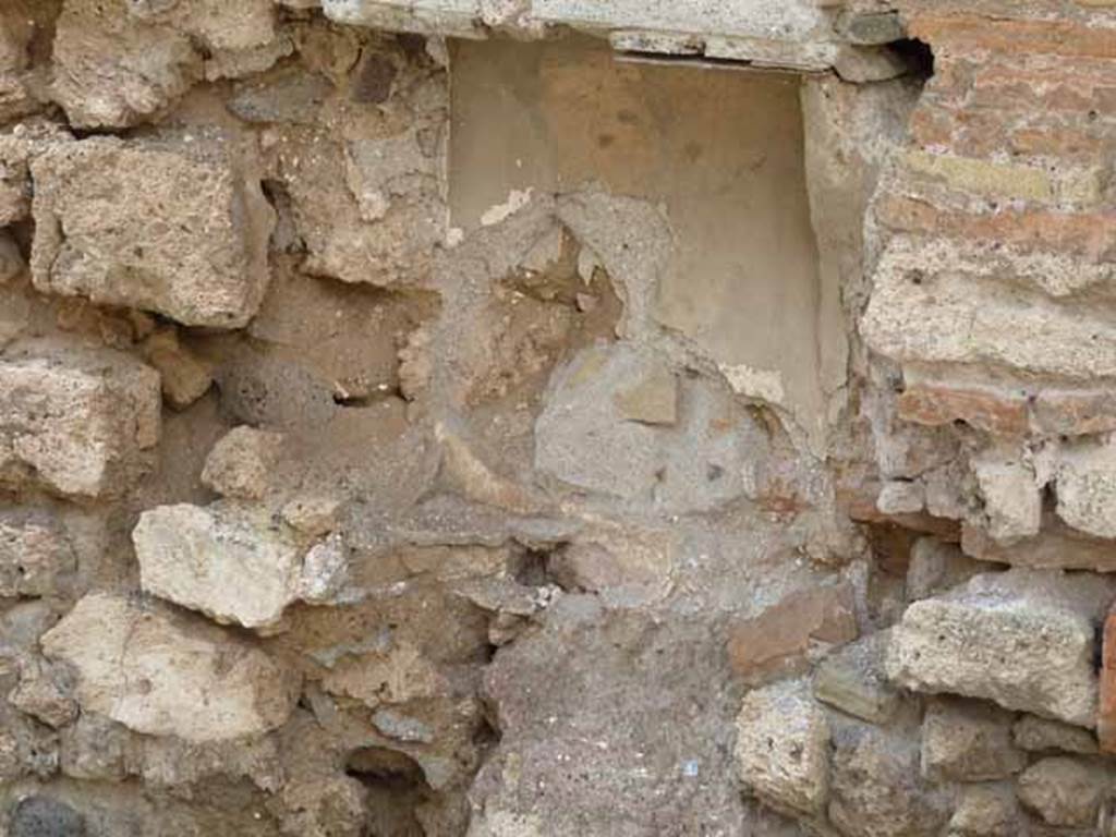 I.6.1 Pompeii. May 2010. Remains of rectangular niche in west wall.