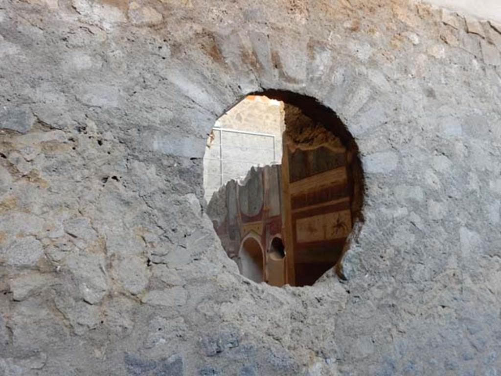 I.6.2 Pompeii. May 2016. Looking through circular window into frigidarium, from east wing of cryptoporticus. Photo courtesy of Buzz Ferebee.
