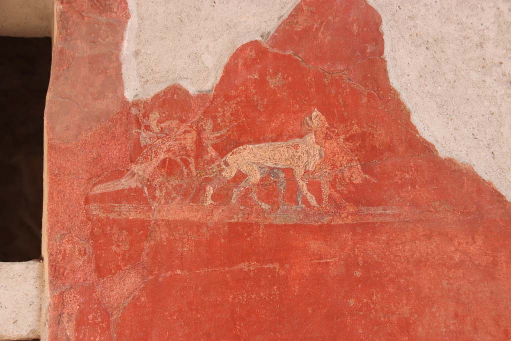 I.6.7 Pompeii. May 2010. Small painted panthers pulling a cart with the attributes of Dionysus, on south side of doorway of east wall of atrium.