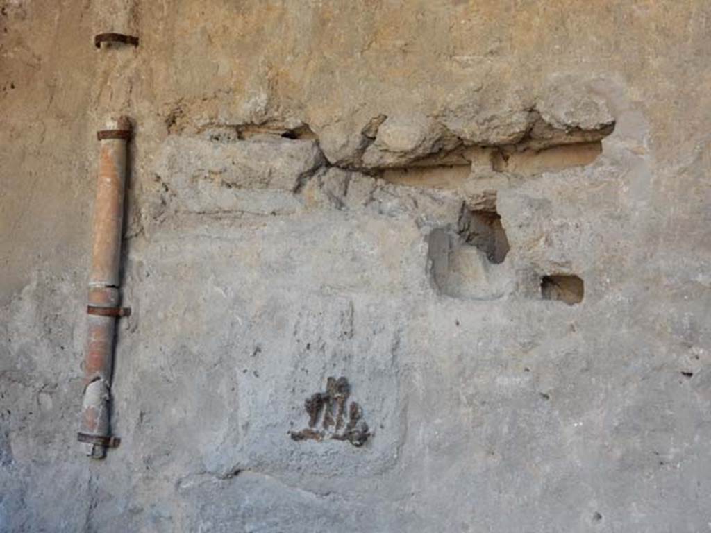 I.6.7 Pompeii. May 2016. Looking south-east towards east end of kitchen showing base of downpipe, and pots. Photo courtesy of Buzz Ferebee.
