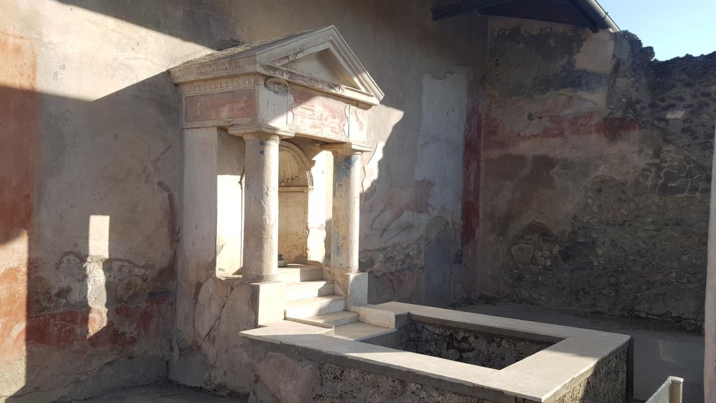 I.7.12 Pompeii. August 2023. Nymphaeum and water tank on south side of garden. Photo courtesy of Maribel Velasco.