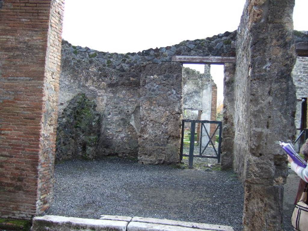 I.8.6 Pompeii. December 2005. Entrance doorway, looking south to rear room and doorway into atrium of I.8.5.