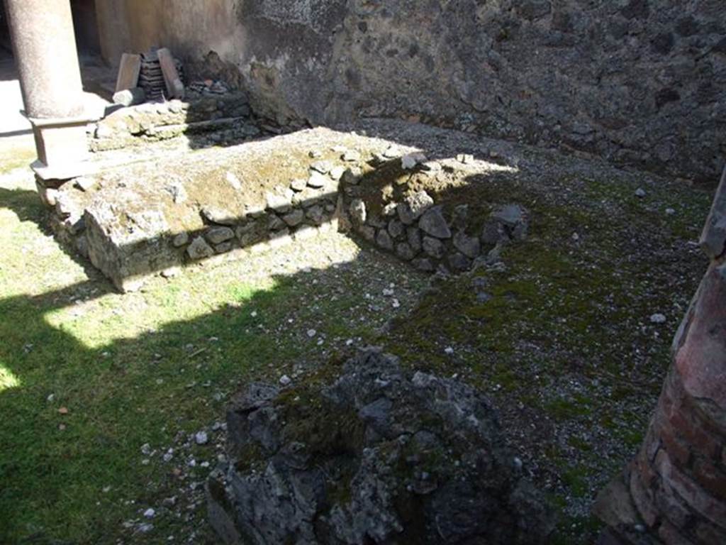 I.8.9 Pompeii. May 2015. Room 9, looking east towards the southern triclinium couch, with remains of yellow plaster on the outside.  Photo courtesy of Buzz Ferebee.


