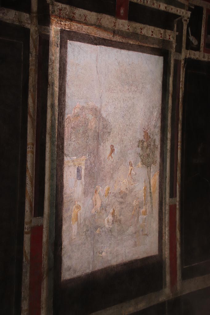 I.9.5 Pompeii. October 2024.
Room 10, west wall of triclinium with central painting of Acteon and Artemis, or Diana. 
Photo courtesy of Klaus Heese
