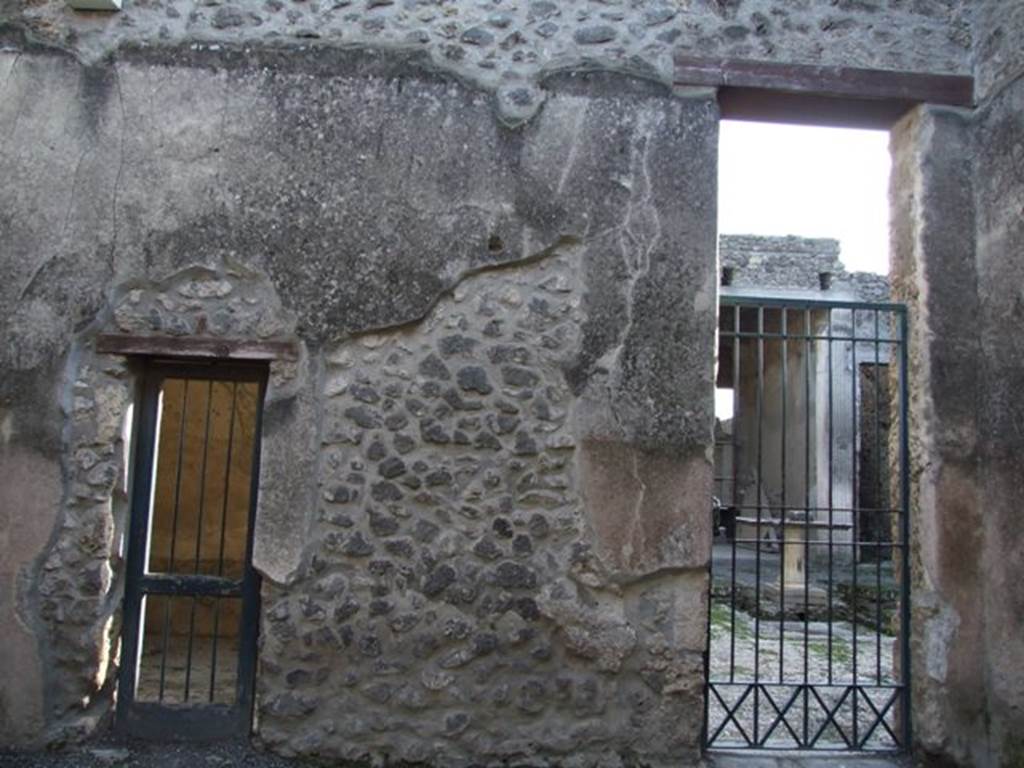 I.9.6 Pompeii. December 2007. South wall.  Doorway on the left is to cubiculum of I.9.5. Doorway on the right is to the atrium of I.9.5.
