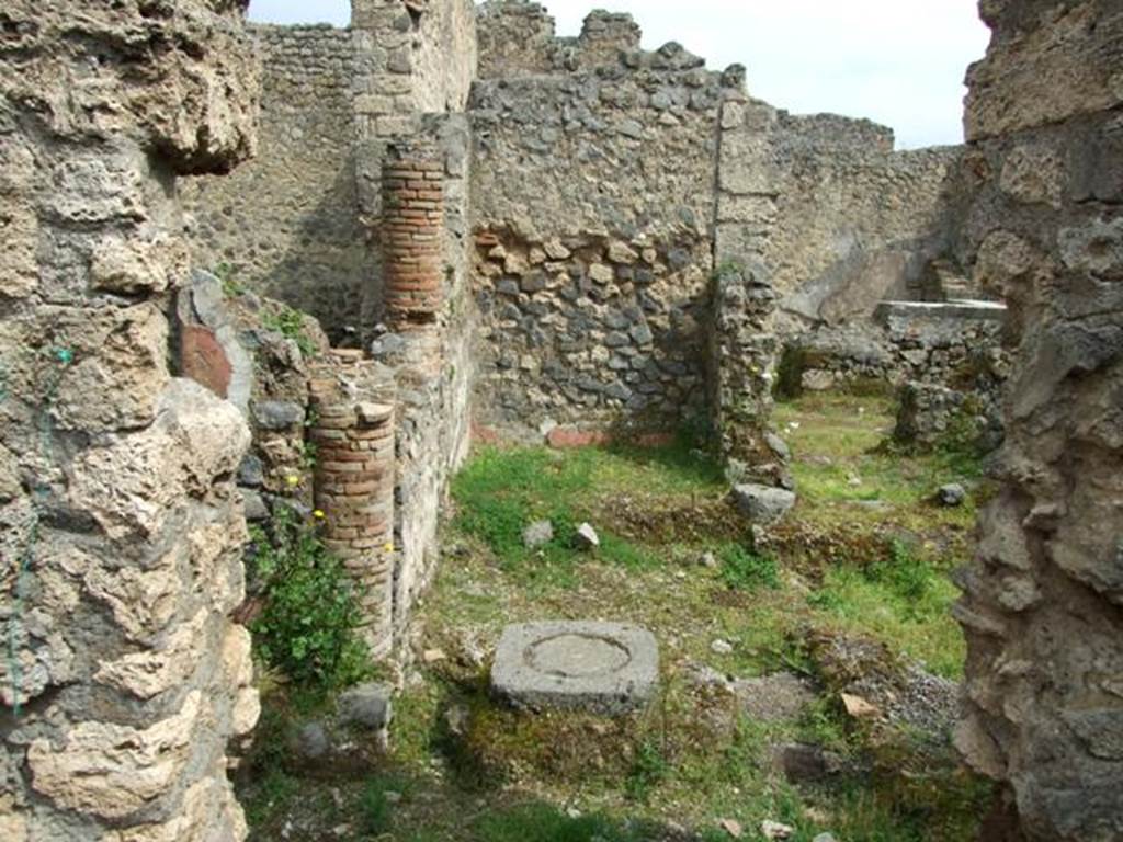 I.9.12 Pompeii. March 2009.  Room 9. Looking east into room with remains of walls, bricked in columns and cistern, eventually leading to the bar at I.9.11