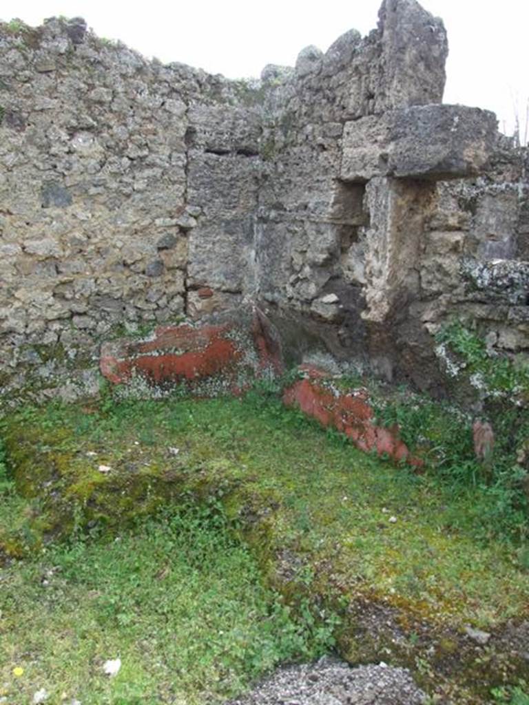 I.9.12 Pompeii. March 2009.  Room 9. Remains of Triclinium in south west corner of room.