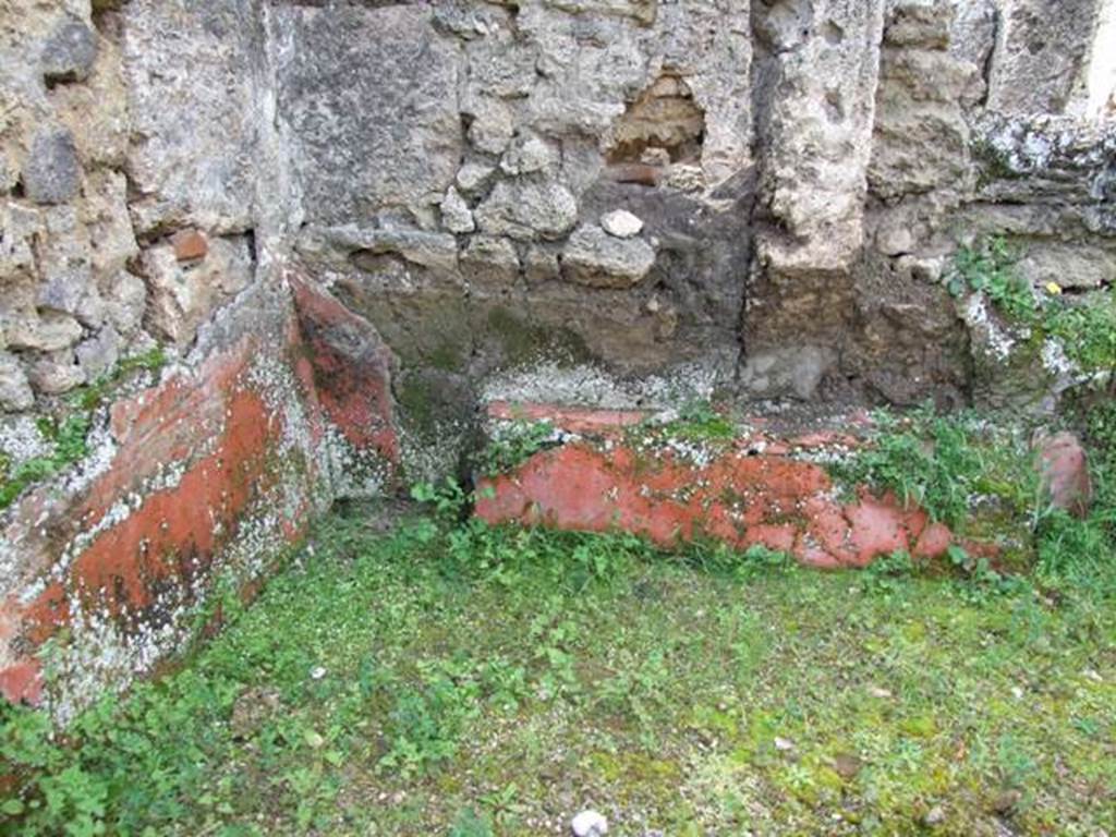 I.9.12 Pompeii. March 2009.  Room 9. South west corner with remains of painted plaster.