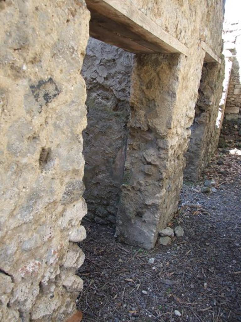 I.10.4 Pompeii. March 2009. Doorway to kitchen corridor M1 (on left) and room 28, to east of kitchen (on right)
