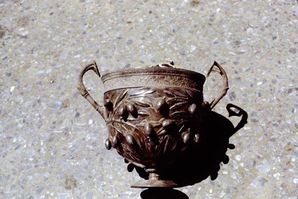 I.10.4 Pompeii. 1971. Silver cup decorated with olives.  Photo by Stanley A. Jashemski.
Source: The Wilhelmina and Stanley A. Jashemski archive in the University of Maryland Library, Special Collections (See collection page) and made available under the Creative Commons Attribution-Non Commercial License v.4. See Licence and use details. J71f0269
