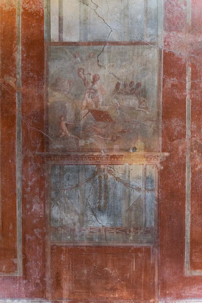 I.10.4 Pompeii. September 2021. Room 4, detail from above the central wall painting on south wall. Photo courtesy of Klaus Heese.