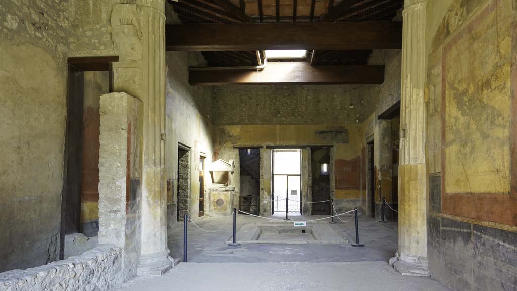 I.10.4 Pompeii. August 2021. 
Looking south across impluvium in atrium towards the tablinum, room 8. Photo courtesy of Robert Hanson.
