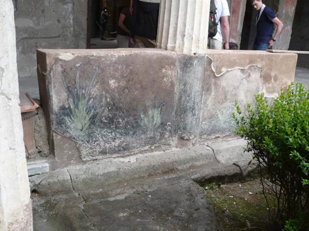 I.10.4 Pompeii. May 2012. Looking towards north portico and painted pluteus, with terracotta puteal, on left.  Photo courtesy of Buzz Ferebee.
