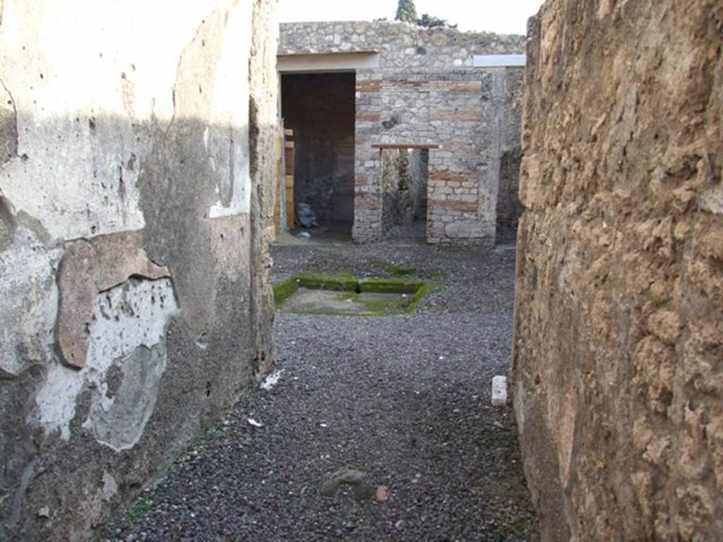 I.10.8 Pompeii. December 2007. Looking along fauces to atrium 1 and rear rooms 6, 7 and 8.
According to Wallace-Hadrill, this is possibly identified as a weaving establishment, on basis of loom weights and graffiti found.
A large range of domestic objects was also found here.
See Wallace-Hadrill, A. (1994). Houses and Society in Pompeii and Herculaneum. Princetown Univ. Press, (p.193)
For details of “finds” from this house,
See Allison, P.M. (2006). The Insula of the Menander at Pompeii: Vol. III The finds, Clarendon Press, Oxford, (p.214-230 & p.350-365).
See Online companion with list and photographs of finds from I.10.8
