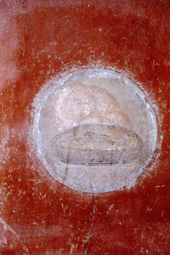 I.10.11 Pompeii, 1968. Room 2, painted medallion of bread and plate, from north-west corner of atrium. 
Photo by Stanley A. Jashemski.
Source: The Wilhelmina and Stanley A. Jashemski archive in the University of Maryland Library, Special Collections (See collection page) and made available under the Creative Commons Attribution-Non Commercial License v.4. See Licence and use details.
J68f0491
