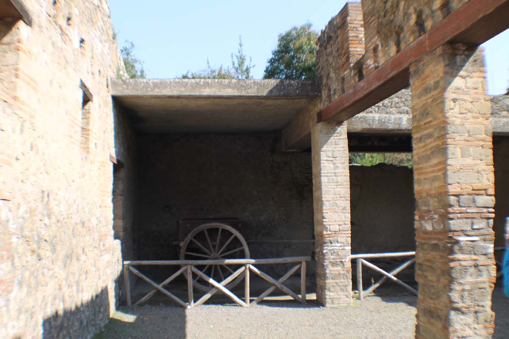 I.10.4 Pompeii. March 2014. Looking towards east side of stable, with two-wheeled cart, on left, and blocked doorway, on right.
Foto Annette Haug, ERC Grant 681269 DCOR.
