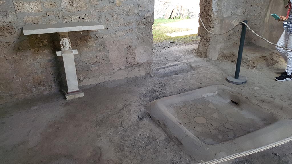 I.10.16 Pompeii. August 2023. Looking towards west side of atrium, and doorway to garden. Photo courtesy of Maribel Velasco.